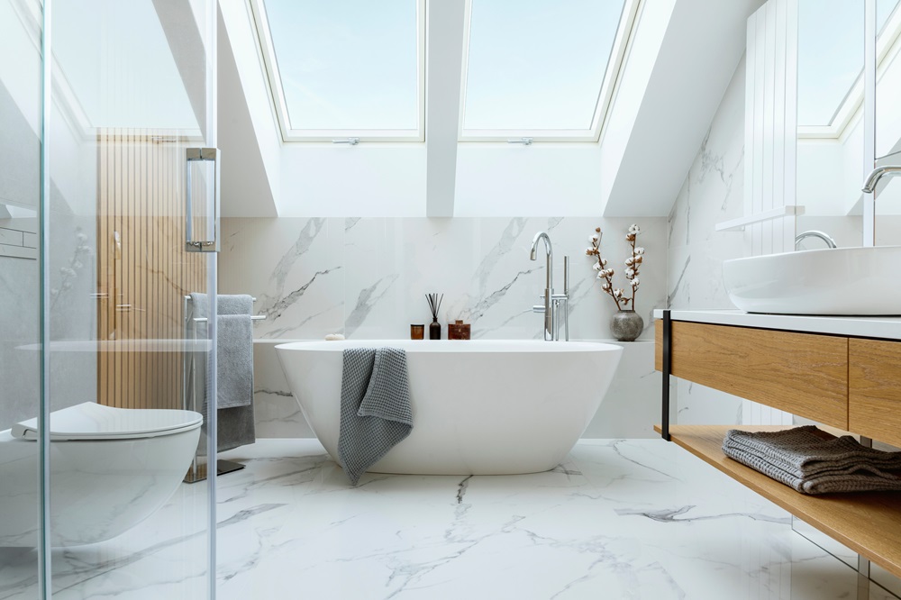 Stylish,Bathroom,Interior,Design,With,Marble,Panels.,Bathtub,,Towels,And